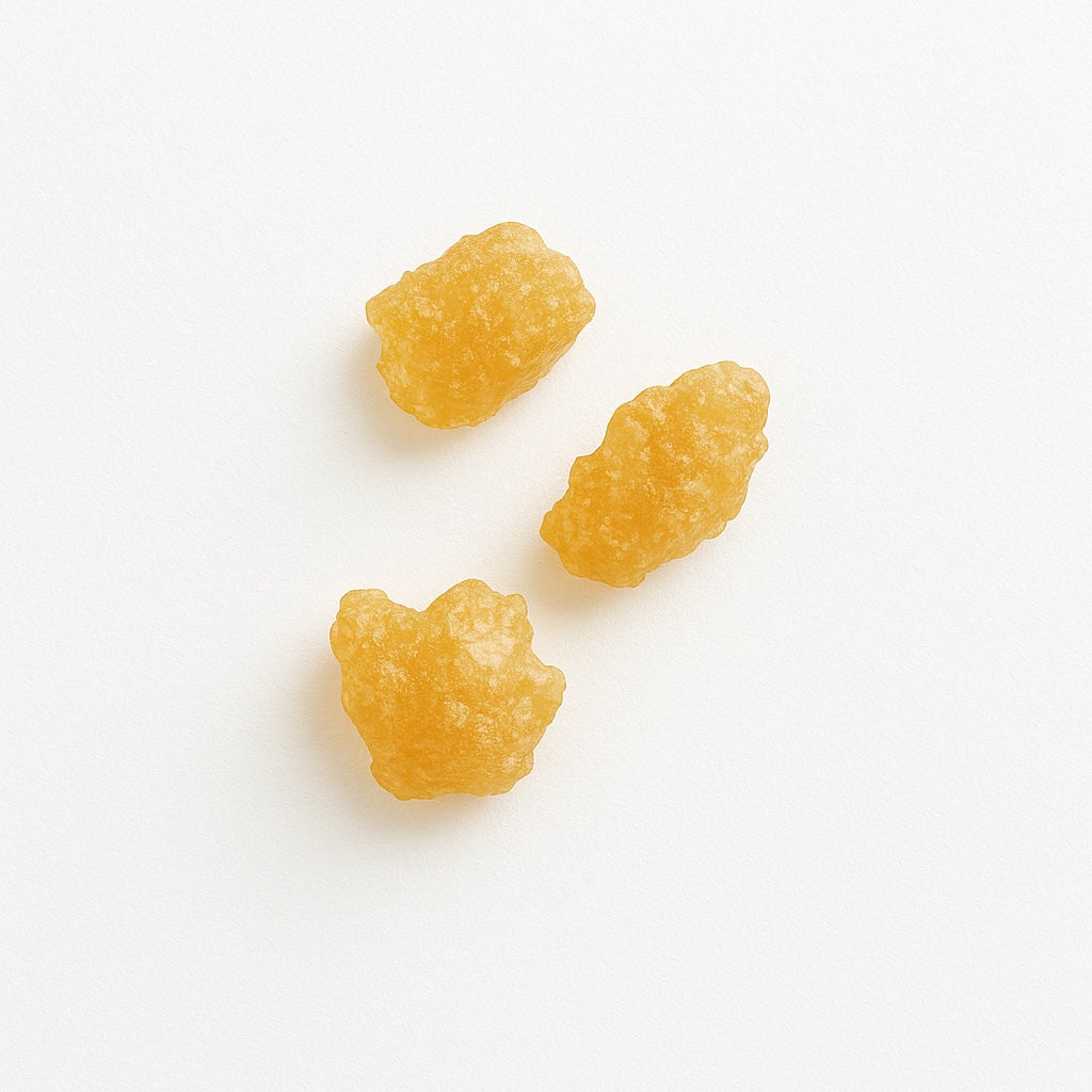 acacia gum crystals on a white background