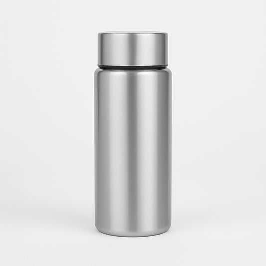 Stainless steel water bottle with silver cap on a light gray background